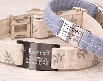 May include: Two pet collars with metal buckles and personalized ID plates. One collar is cream with a green leaf pattern and a black plate reading Korra, I'm microchipped, Mom: 123-456-7890, Dad: 456-123-7890. The other is blue with a white grid and a silver plate reading Kitten, Call my family: 123-456-7890.