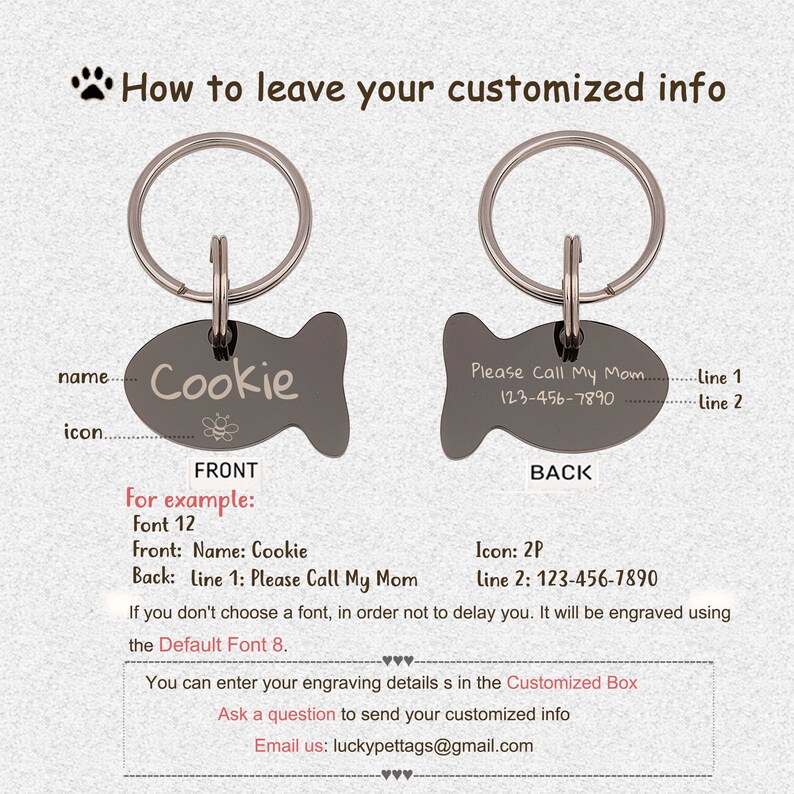 May include: A silver fish-shaped pet tag with a black background. The front of the tag says "Cookie" with a small bee icon. The back of the tag says "Please Call My Mom 123-456-7890".
