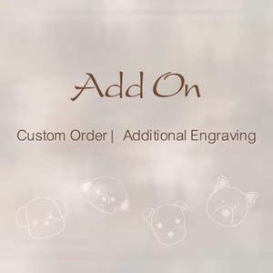 May include: A light brown graphic featuring the dark brown text Add On followed by Custom Order | Additional Engraving. Below the text are four simple white line-art illustrations of dog faces arranged in a horizontal row across the bottom.