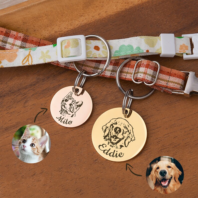May include: Two personalized pet ID tags with engraved images of a cat and a dog. The cat tag is rose gold with the name "Milo" and the dog tag is gold with the name "Eddie".