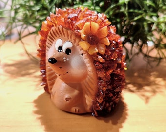 Hedgehog, made of clay and amber.