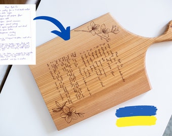 Recipe cutting board with handle
