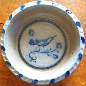 May include: A set of three ceramic mugs with a speckled, matte finish. The mugs are in shades of cream, light gray, and dark gray. Each mug has a simple, minimalist design, perfect for coffee or tea.