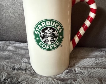 Taza de café navideña con diseño de bastón de caramelo de Starbucks 2009