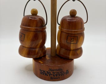 Wooden salt and pepper set features miniature hanging kegs and is labeled with "Marriott's Tan-Tar-A Resort."