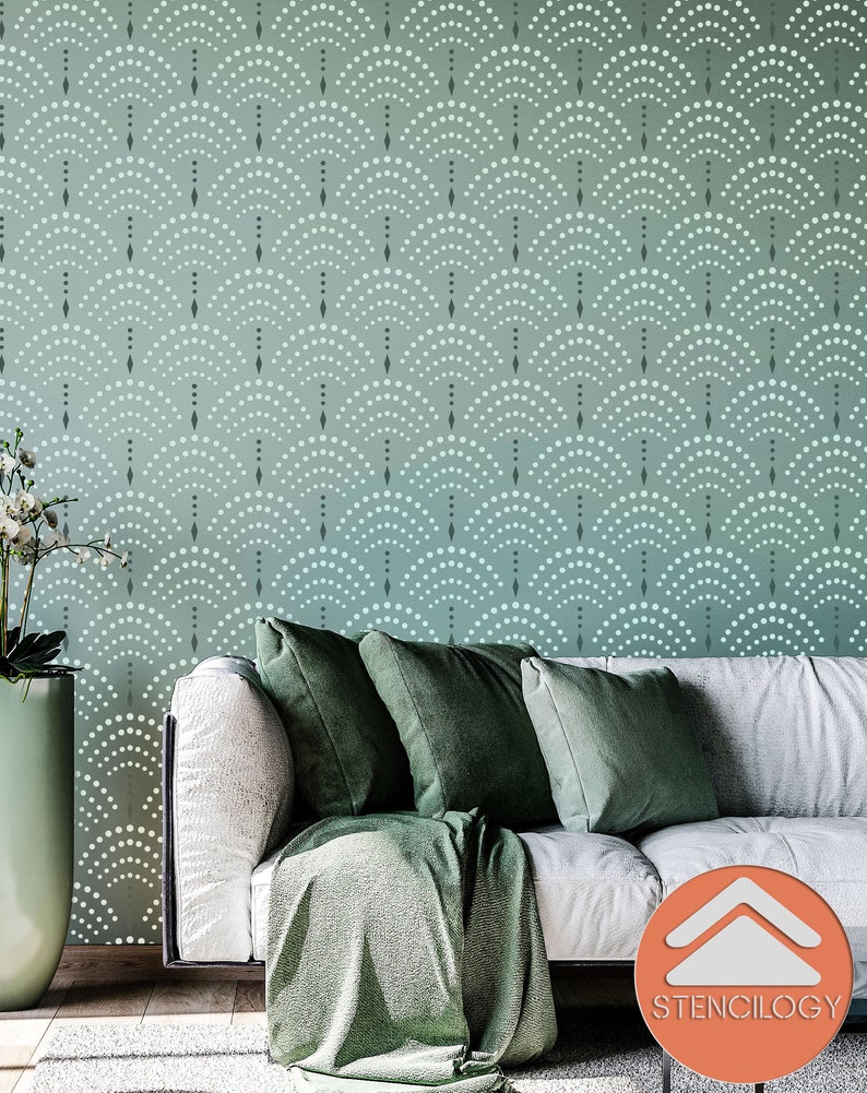 May include: A white couch with green throw pillows and a green throw blanket in front of a wall with a teal and white geometric pattern. The pattern is made up of small circles and diamonds. The text "STENCILOGY" is visible in the lower right corner of the image.