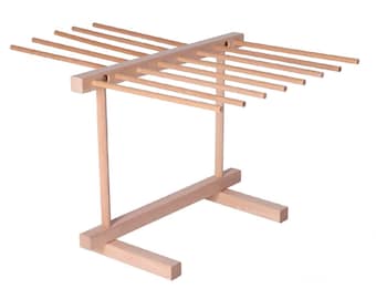 May include: A wooden dish drying rack with 10 dowels for drying dishes. The rack has a natural wood finish and a simple design.