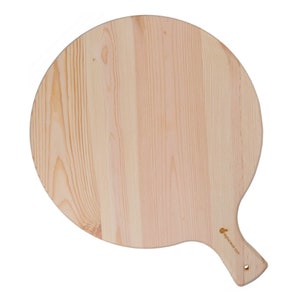 May include: A round, light-colored wooden pizza peel with a handle. The peel has a natural wood grain pattern and a small logo on the handle. The handle has a hole for hanging. The peel is designed for transferring pizzas.
