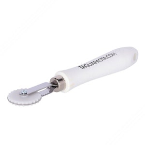 May include: White pasta cutter with a serrated wheel and a white handle. The handle has the text TAGLIAPASTA.COM printed on it. The cutter is made of stainless steel and plastic.