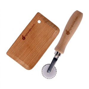 May include: A set of three ceramic mugs with a speckled, matte finish. The mugs are in shades of cream, light gray, and dark gray. Each mug has a simple, minimalist design, perfect for coffee or tea.