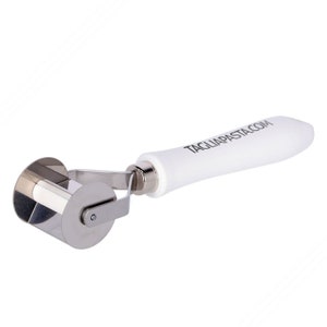 May include: A white handled pasta roller with a stainless steel blade. The handle has the text "TAGLIAPASTA.COM" printed on it.