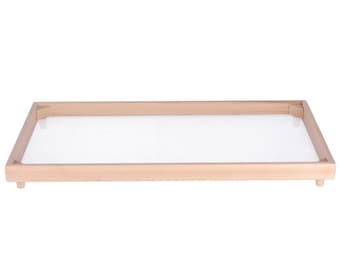 May include: A wooden frame with a white mesh insert. The frame is light brown and has a rectangular shape.
