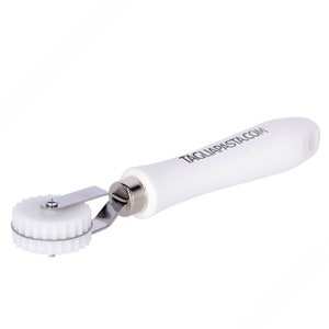 May include: White pasta roller with a white handle and the text "TAGLIAPASTA.COM" printed on the handle.