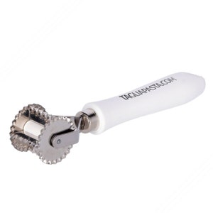May include: A pasta cutter with a white handle and two fluted cutting wheels. The handle has the text TAGLIAPASTA.COM printed on it. The cutting wheels are made of stainless steel.