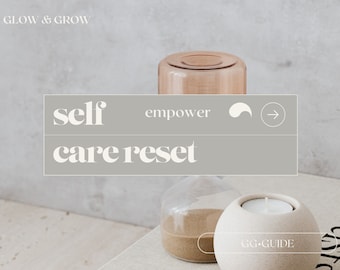 May include: A gray rectangle with the text "self care reset" and the words "empower" and an arrow. The rectangle is in front of a light brown glass jar with sand inside and a white candle holder.