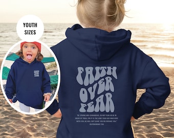 May include: A navy blue hooded sweatshirt featuring the text FAITH OVER FEAR in a large, wavy, light blue font on the back, with the Bible verse Deuteronomy 31:6 printed below. A smaller version of the text is visible on the front chest area.