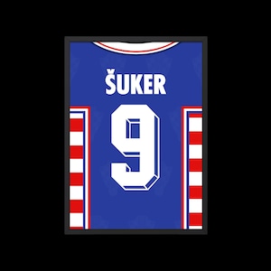 May include: A blue soccer jersey with white and red stripes on the sides. The jersey has the name "&Scaron;UKER" and the number "9" printed on the front.