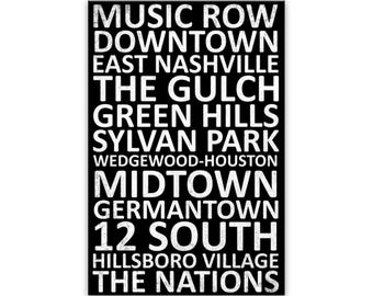 May include: A rectangular black sign featuring white distressed-style text listing Nashville neighborhoods: MUSIC ROW, DOWNTOWN, EAST NASHVILLE, THE GULCH, GREEN HILLS, SYLVAN PARK, WEDGEWOOD-HOUSTON, MIDTOWN, GERMANTOWN, 12 SOUTH, HILLSBORO VILLAGE, THE NATIONS.
