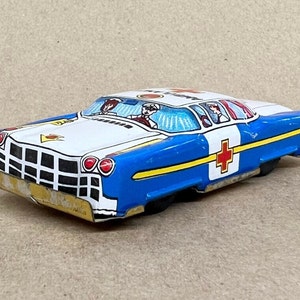 Vintage Tin Litho Toy Ambulance: Noumra TN Friction Chevrolet, Japan