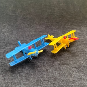 Brinquedos biplanos vintage da Primeira Guerra Mundial da década de 1970: JN-4 Jenny e French Nieuport, conjunto de 2