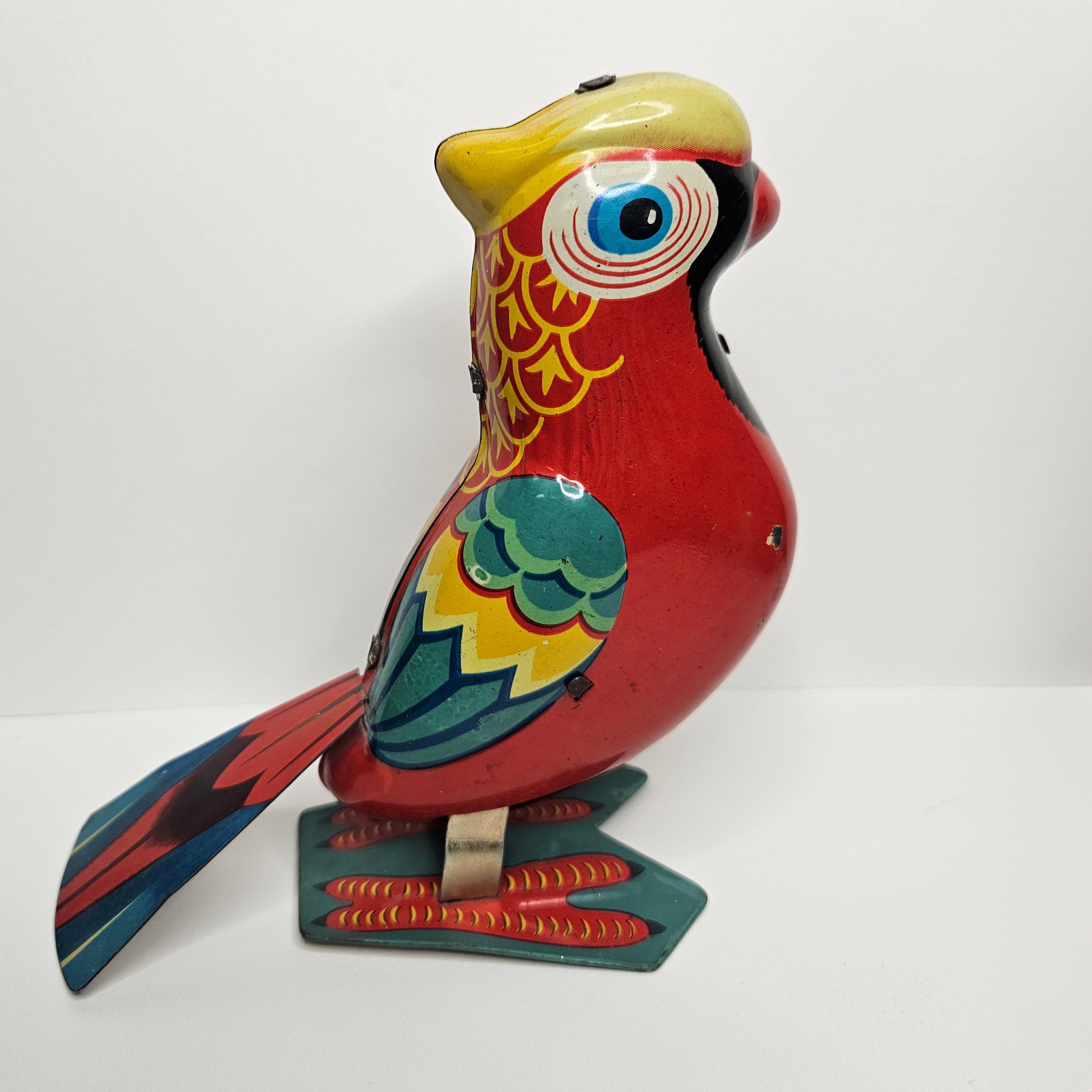 Vintage Tin Litho Wind-up Parrot Toy: Jumping Mechanical Bird