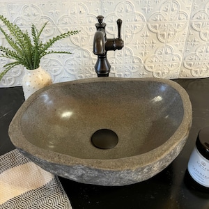 Earthy Boho Style Stone Sink Natural River Rock Basin Bali Inspired Design Bathroom Vanity Fixture Handcrafted Vessel Bowl Java Island Origin Unique Bathroom Feature One Of A Kind Creation Natural Material Construction Organic Home Element