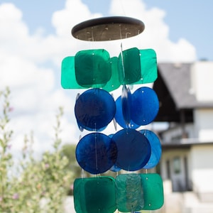 Melodic Wind Chime Garden Sound Maker Coastal Design Mobile Capiz Shell Material Blue Green Color Scheme Outdoor Patio Decoration Sunlight Reflecting Piece Peaceful Garden Addition Beach House Accent Handcrafted Musical Element Nautical