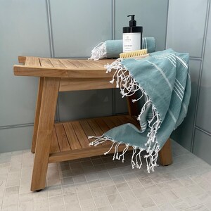 Wooden Bathroom Stool Teak Shower Bench Luxury Spa Seating Boho Style Furniture Minimalist Aesthetic Design Natural Wood Construction Waterproof Material Moisture Resistant Quality Adjustable Feet Feature Comfortable Shower Seat Home Spa