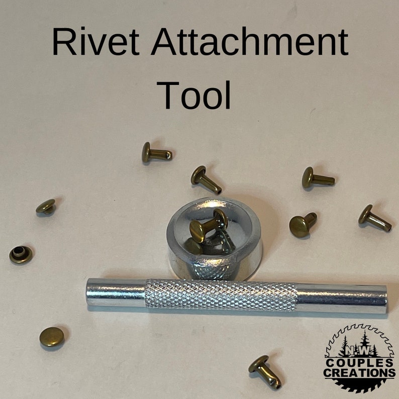 May include: A silver rivet attachment tool with a wooden handle and a silver base. The tool is surrounded by several gold-colored rivets.