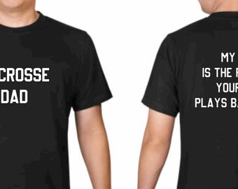 May include: Black t-shirt with white text. The front of the shirt says "Lacrosse Dad". The back of the shirt says "My kid is the reason your kid plays baseball."
