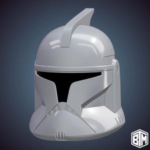 May include: A gray, futuristic helmet with a prominent fin on top. The helmet features a visor and detailed facial features, with a smooth, reflective surface. The design is reminiscent of science fiction or military themes.