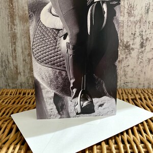 Stunning equestrian photography of horse and rider leg stirrup side of horse and saddle