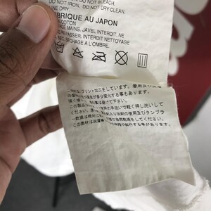 May include: A rustic wooden sign with the text "Welcome to our home" in white lettering. The sign features a distressed finish and a simple, inviting design, perfect for entryway decor.