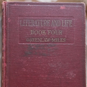 May include: A vintage book with a burgundy cover. The title "LITERATURE AND LIFE" is embossed in gold lettering, along with "BOOK FOUR" and the author's name. The book's cover shows signs of wear.