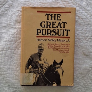 May include: A book cover with a tan background and black text that reads "THE GREAT PURSUIT" by Herbert Molloy Mason, Jr. The cover features a black and white photo of a man on horseback.