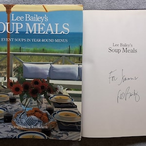 May include: A signed copy of Lee Bailey's cookbook "Soup Meals: Main Event Soups in Year-Round Menus". The book is signed "For Kame" and "Lee Bailey".