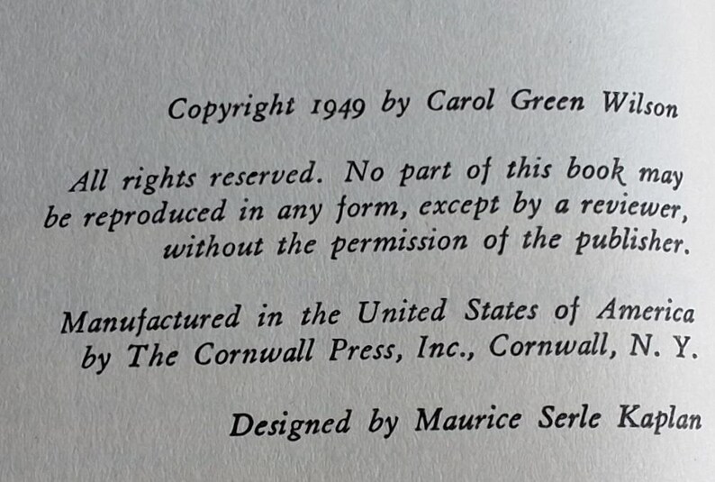 May include: Close-up of a printed page with text. The text includes copyright information from 1949 by Carol Green Wilson, manufacturing details from The Cornwall Press, and design credits to Maurice Serle Kaplan.