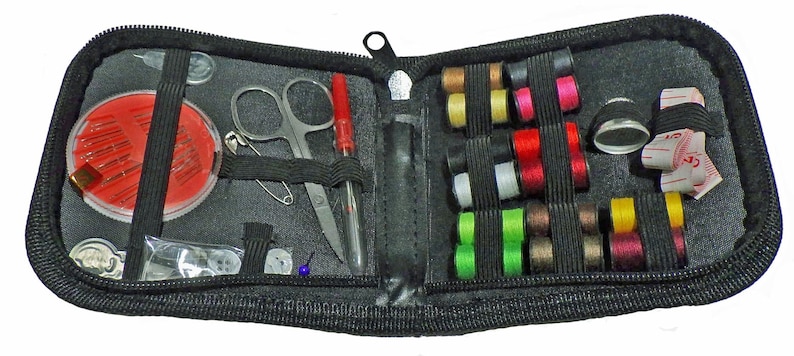 May include: A black zippered travel sewing kit with a variety of sewing supplies, including needles, thread, buttons, a thimble, scissors, and a tape measure.