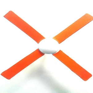 May include: A ceiling fan featuring four orange blades radiating from a white central hub. The blades are a bright orange hue, and the fan is designed for ceiling mounting. The fan's design is minimalist and contemporary, suitable for diverse interior settings.