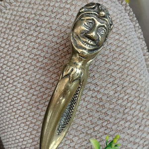 Solid Brass Nutcracker in the form of smiling jesters, vintage tool for shelling
