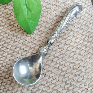 South African Pewter Sugar Spoon, Jenna Clifford rose collection, curved handle