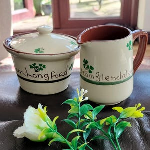 May include: A rustic wooden sign with the text "Welcome to our home" in white lettering. The sign features a distressed finish and a simple, inviting design, perfect for front door decor.