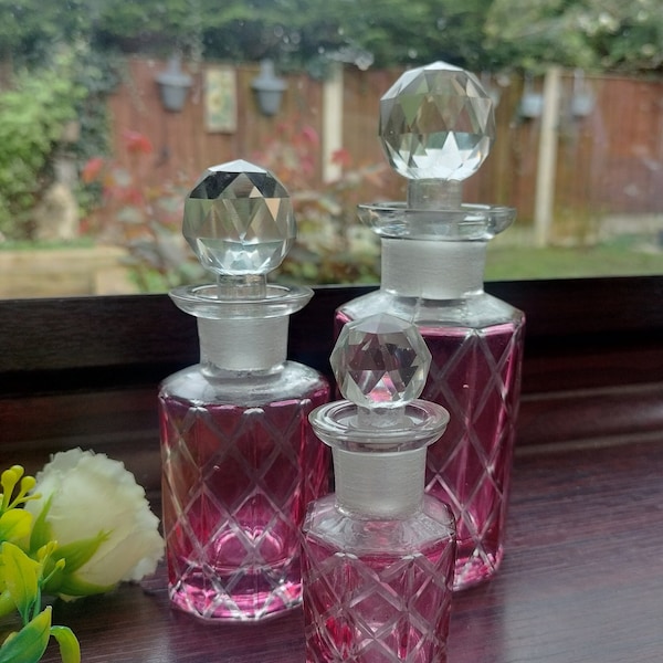 Perfume Bottle Set, 3 graduated pieces with cranberry flash and crystal stoppers