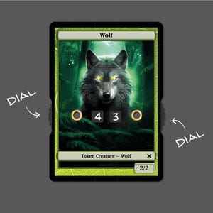 May include: A green and black card with a wolf illustration. The card has the text "Wolf" and "Token Creature - Wolf" on it. The card has a 2/2 power and toughness.