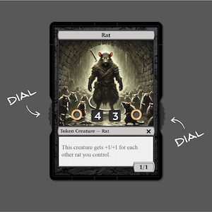 May include: A black and white card game card with a rat illustration. The card text reads "Rat" and "Token Creature - Rat". The card also has a power and toughness of 1/1.