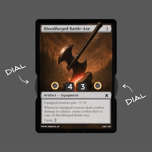 May include: A fantasy card featuring a battle axe illustration with the text "Bloodforged Battle-Axe." The card has a black border, with dials and text. The background shows a fiery, dark forest scene.