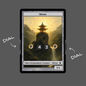 May include: A Magic: The Gathering card depicting a golden shrine on a mountaintop with a waterfall. The card is titled "Shrine" and has the text "Token Enchantment Creature - Shrine 1/1".