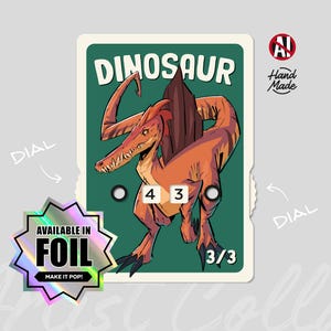 May include: A dinosaur-themed card with a stylized illustration of a Spinosaurus in shades of orange and brown. The card features the word "DINOSAUR" at the top, numbers "4 3" and "3/3", and the text "AVAILABLE IN FOIL".