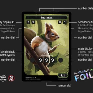 May include: A rectangular game token card featuring an illustration of a squirrel on a branch. The card includes multiple number dials for tracking stats, labeled as secondary displays and a main display. Text includes SQUIRREL, ART SERIES K 26, and AVAILABLE IN FOIL.