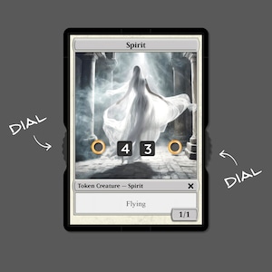 May include: A Magic: The Gathering card depicting a spirit in white fabric. The card is labelled "Spirit" with stats of 4/3 and the text "Flying" and "1/1". Gold dials are present, set against a misty background.